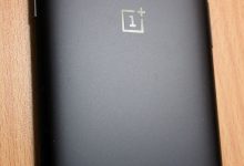 a person unlocking a smartphone with a fingerprint